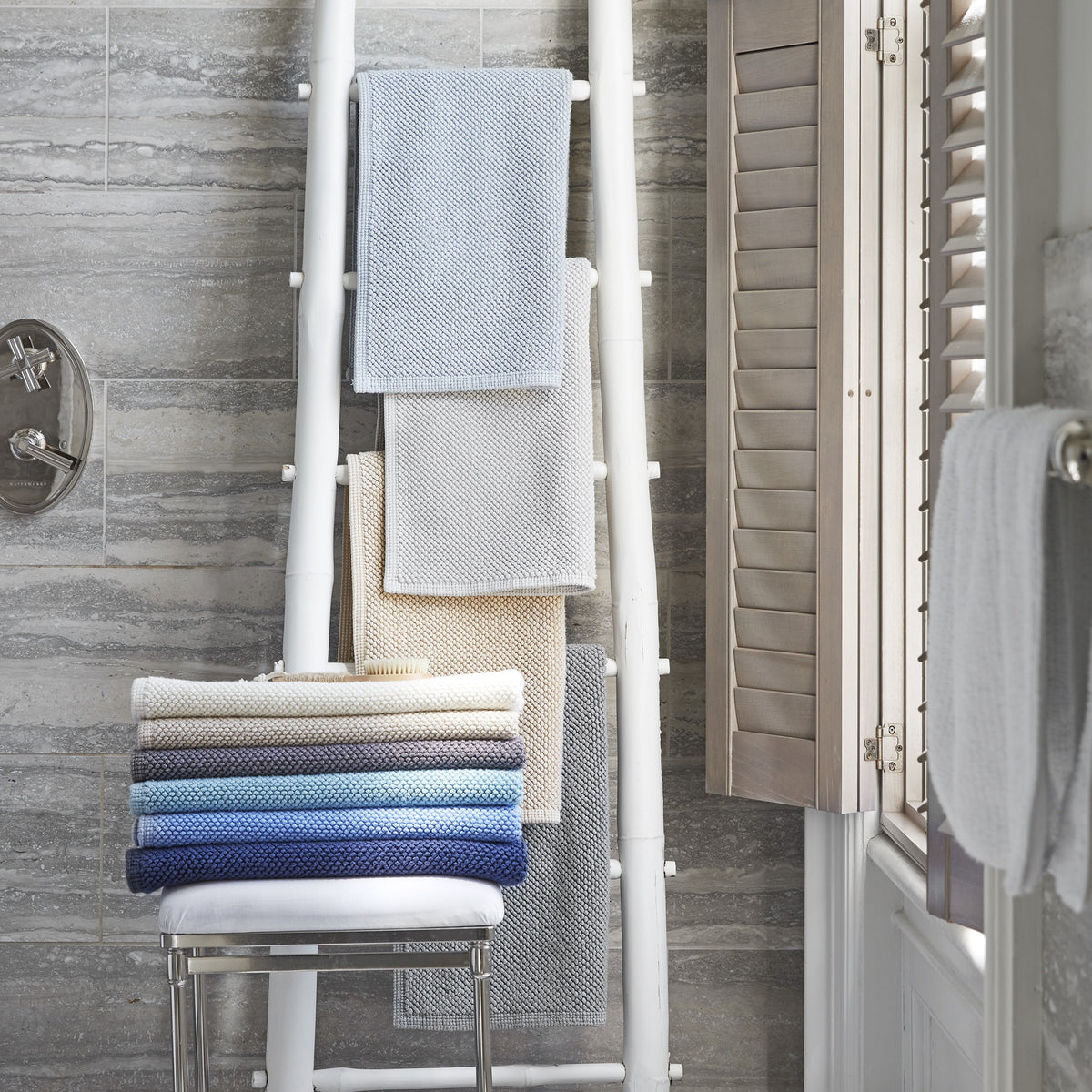 Lifestyle Shot of Matouk Reverie Bath Rugs