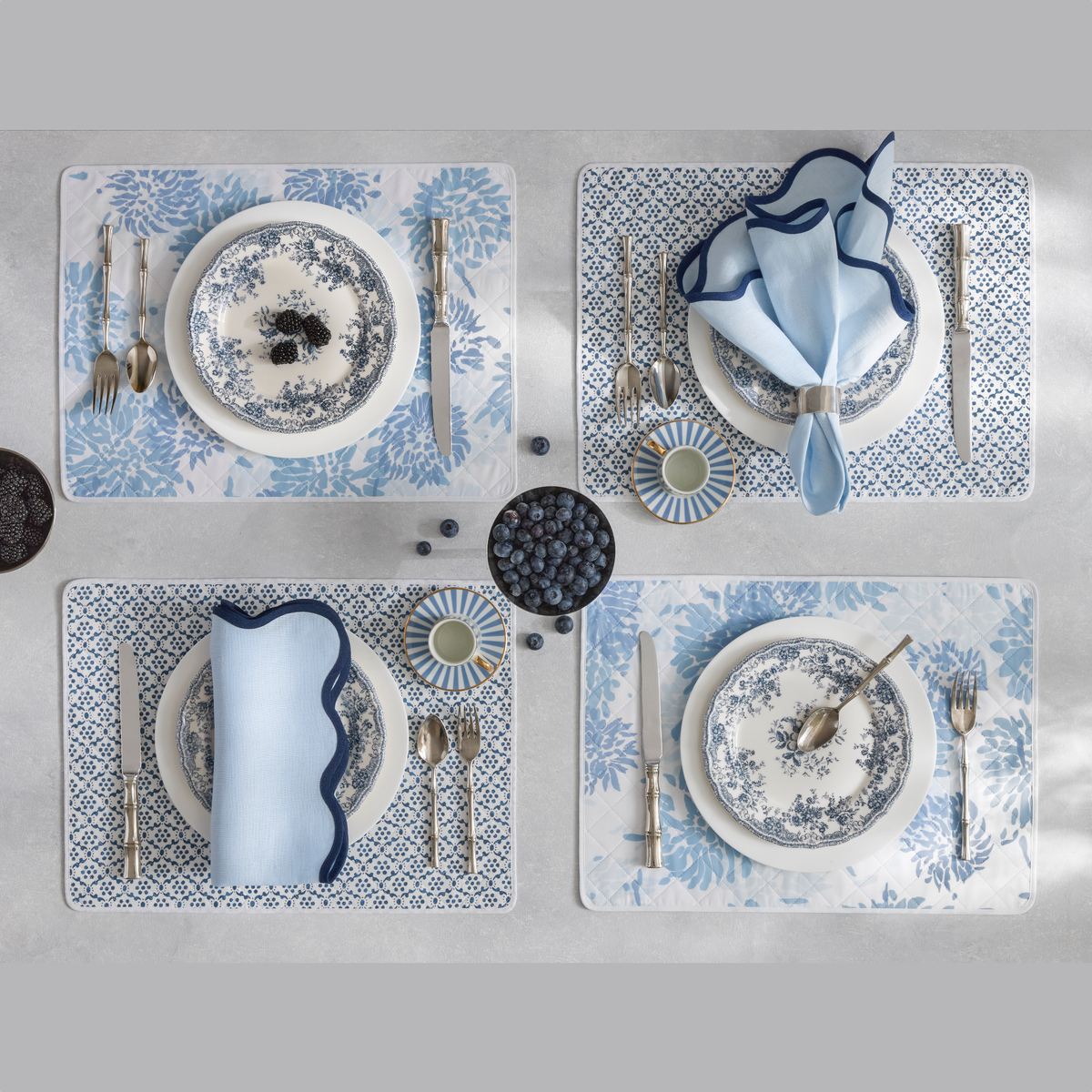 Reversible Quilted Placemat in Chrysanthemum Blue/Laksha Indigo shown with Scallop Edge in Ice Blue & Navy
