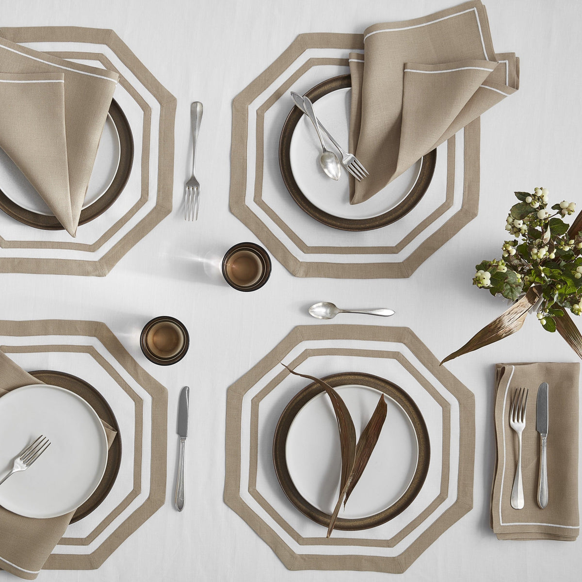 Matouk  Satin Stitch Napkins on a Table with Matouk Double Border Octagon Placemats in Oat Color