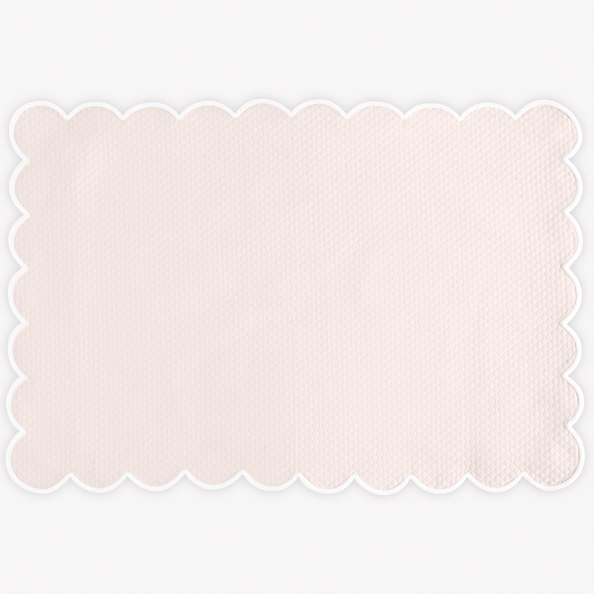 Pink Matouk Savannah Gardens placemat on white background