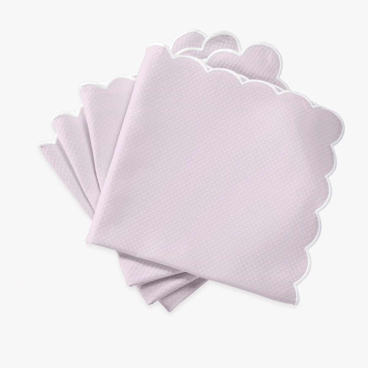Violet napkins with scalloped edges of Matouk Savannah Gardens table linens