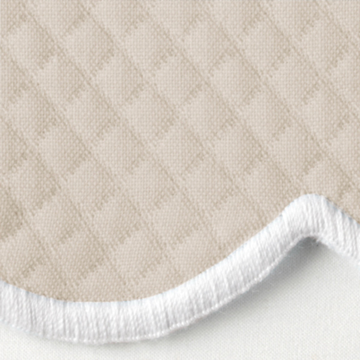 Close-up of Dune Matouk Savannah Gardens diamond pique table linens