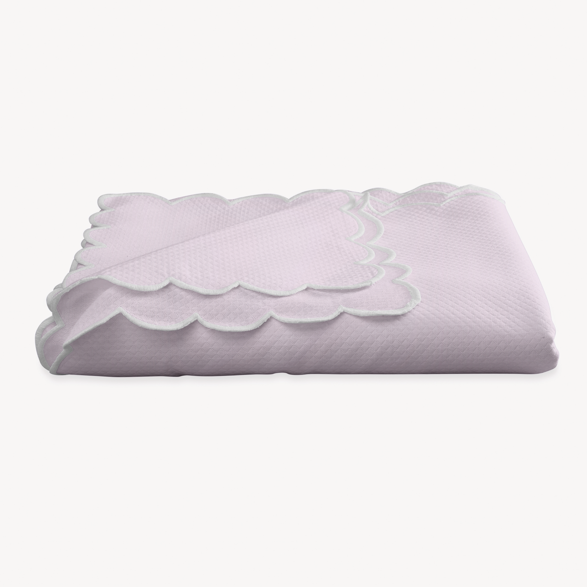 A folded Violet Matouk Savannah Gardens Tablecloth on a white background