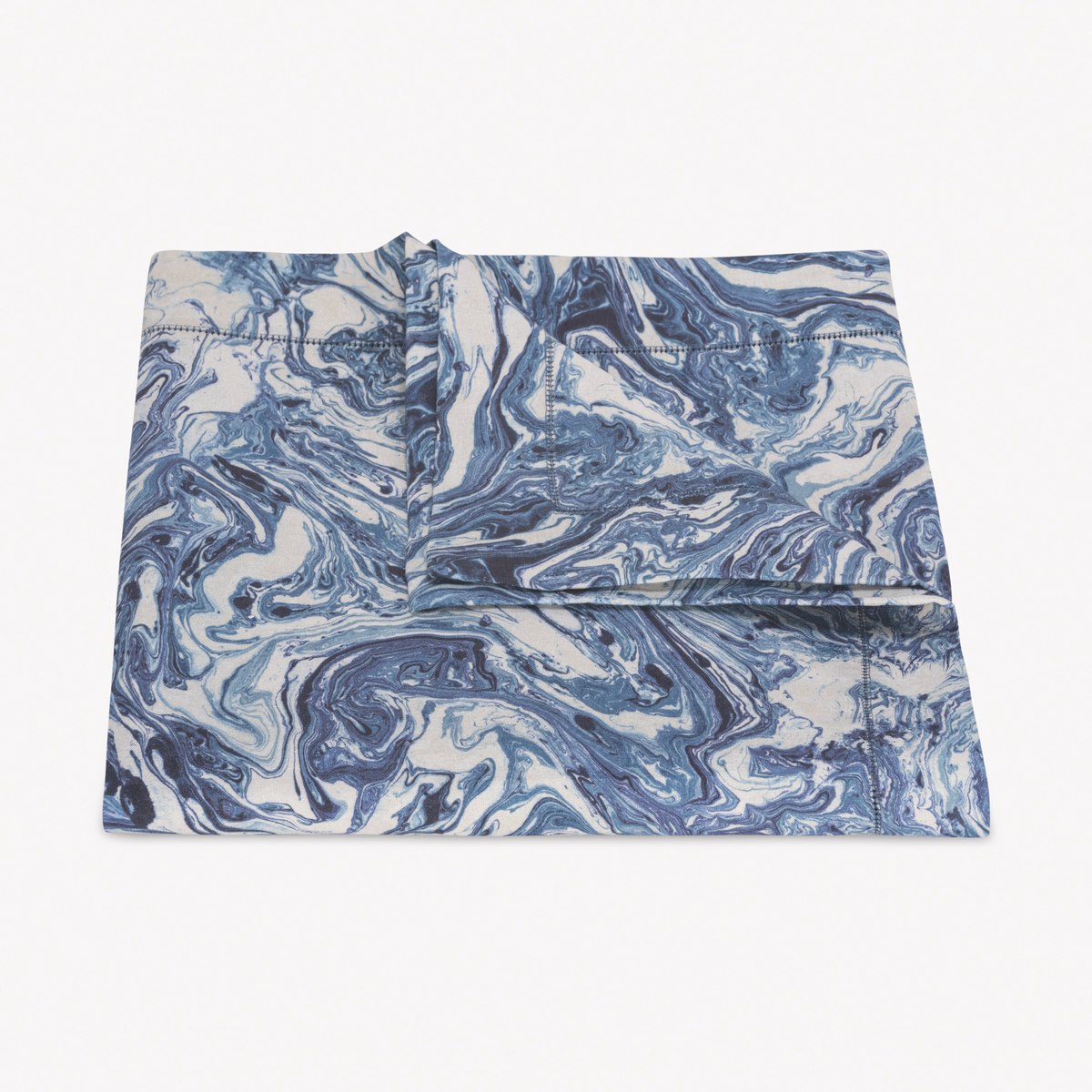 Folded Matouk Schumacher Balthazar Tablecloth in Lapis color