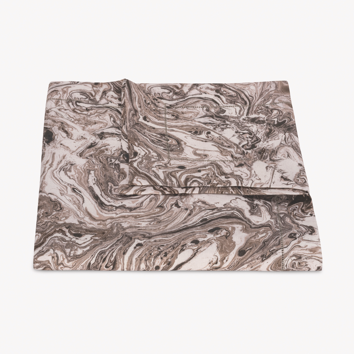 Folded Matouk Schumacher Balthazar Tablecloth in Topaz color