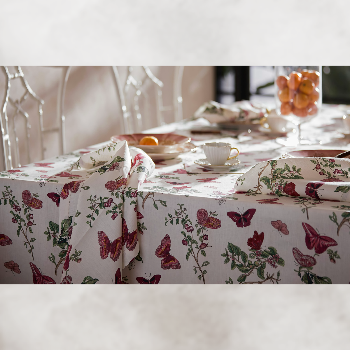 Closeup of Matouk Schumacher Baudin Butterfly Table Linens in Ruby