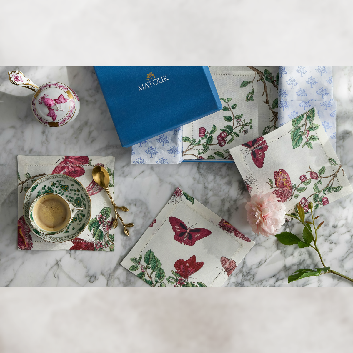 Top view of Matouk Schumacher Baudin Butterfly Table Linens in Ruby