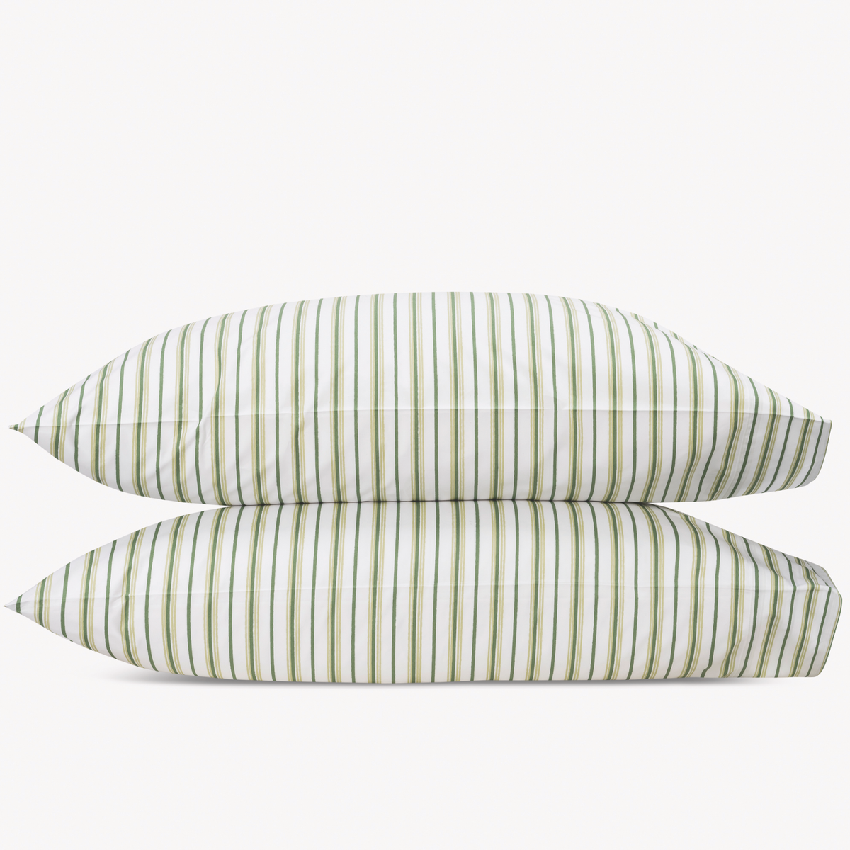 Two Palm Matouk Calypso Pillowcases stacked against a plain background
