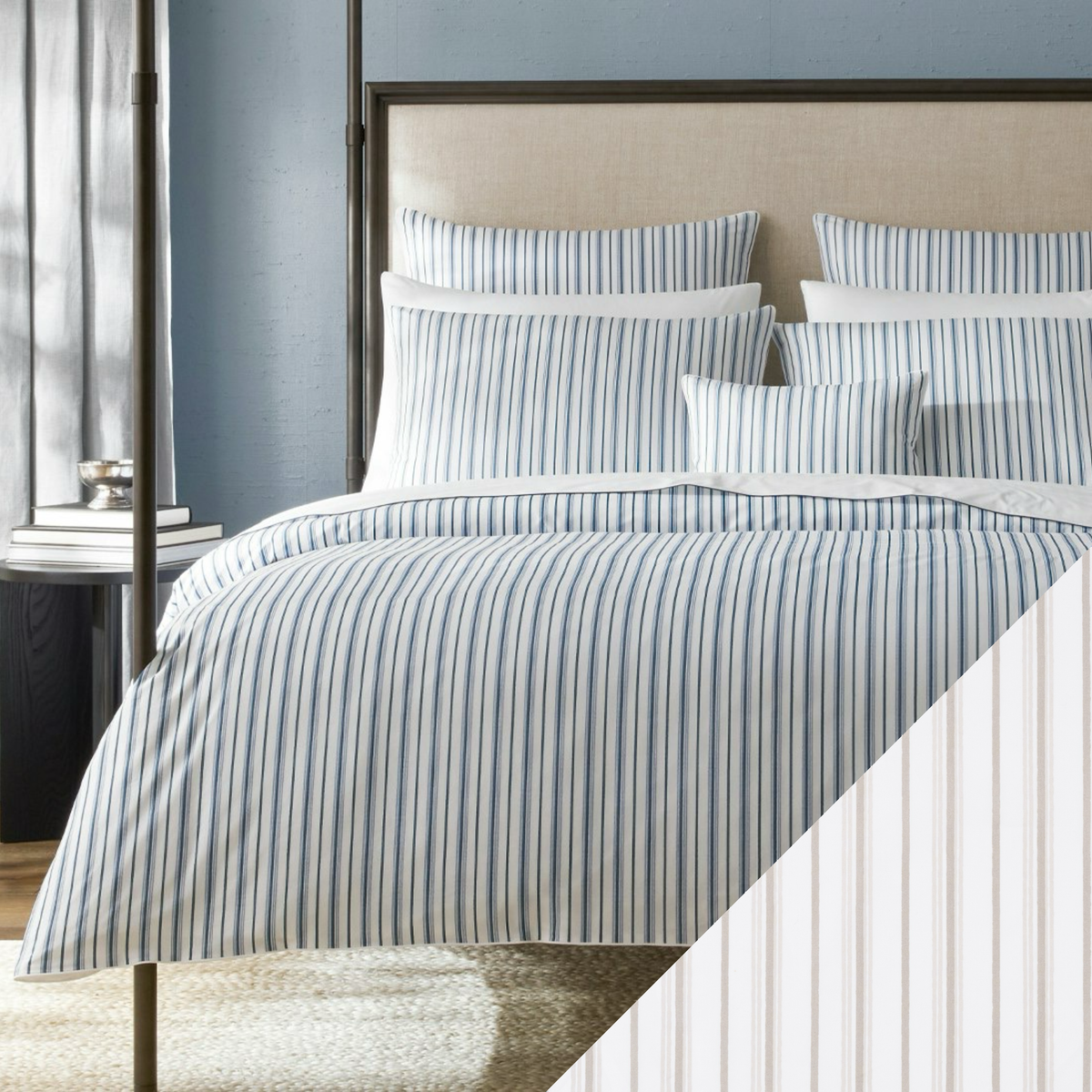 A bed with Matouk Schumacher Calypso Bedding in Prussian Blue collection and Pebble colored swatch sample