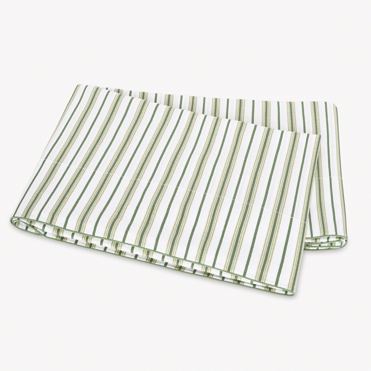 Folded Palm Matouk Calypso Flat Sheet on a plain white surface