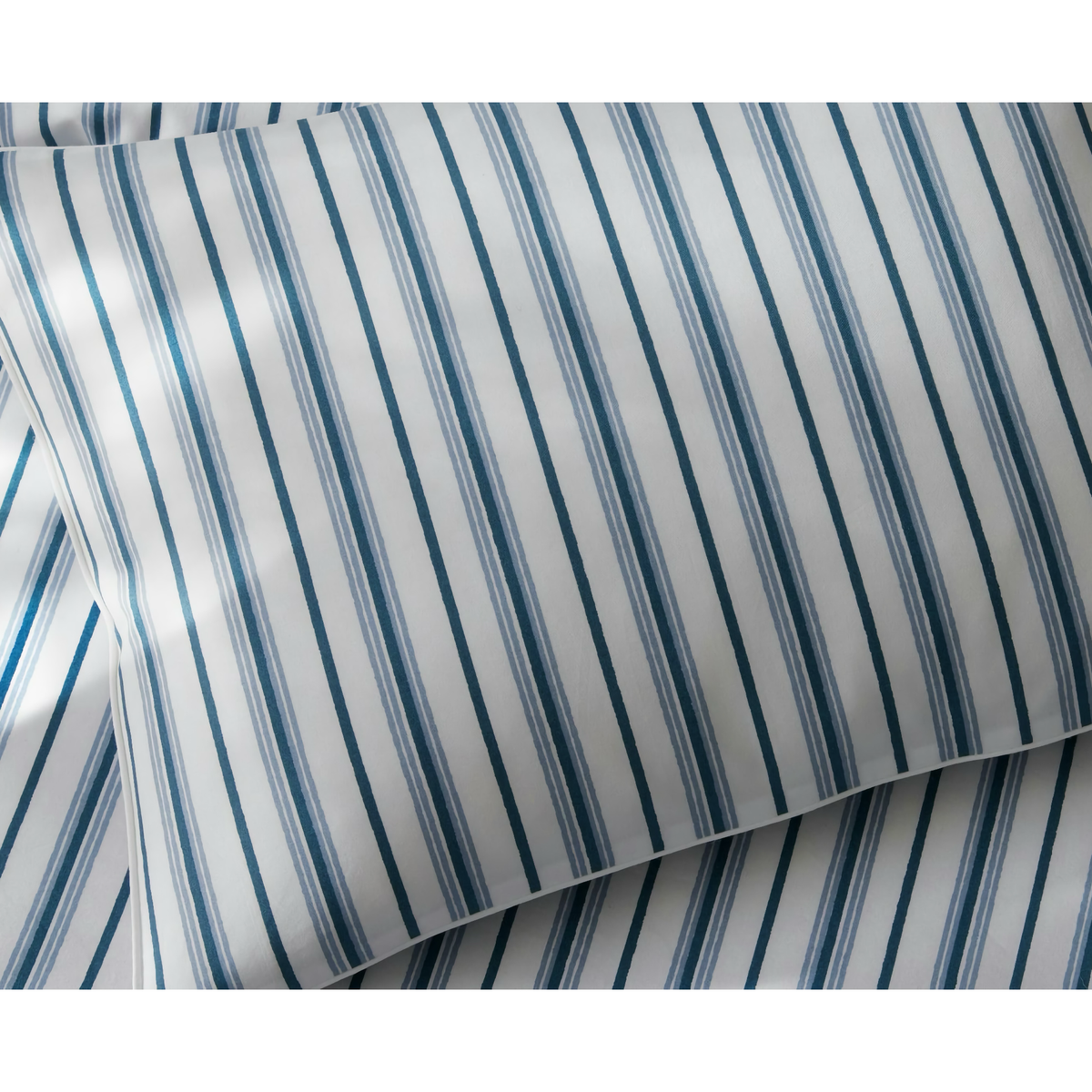 Pillow and Sheet with Prussian Blue stripes of Matouk Calypso Bedding