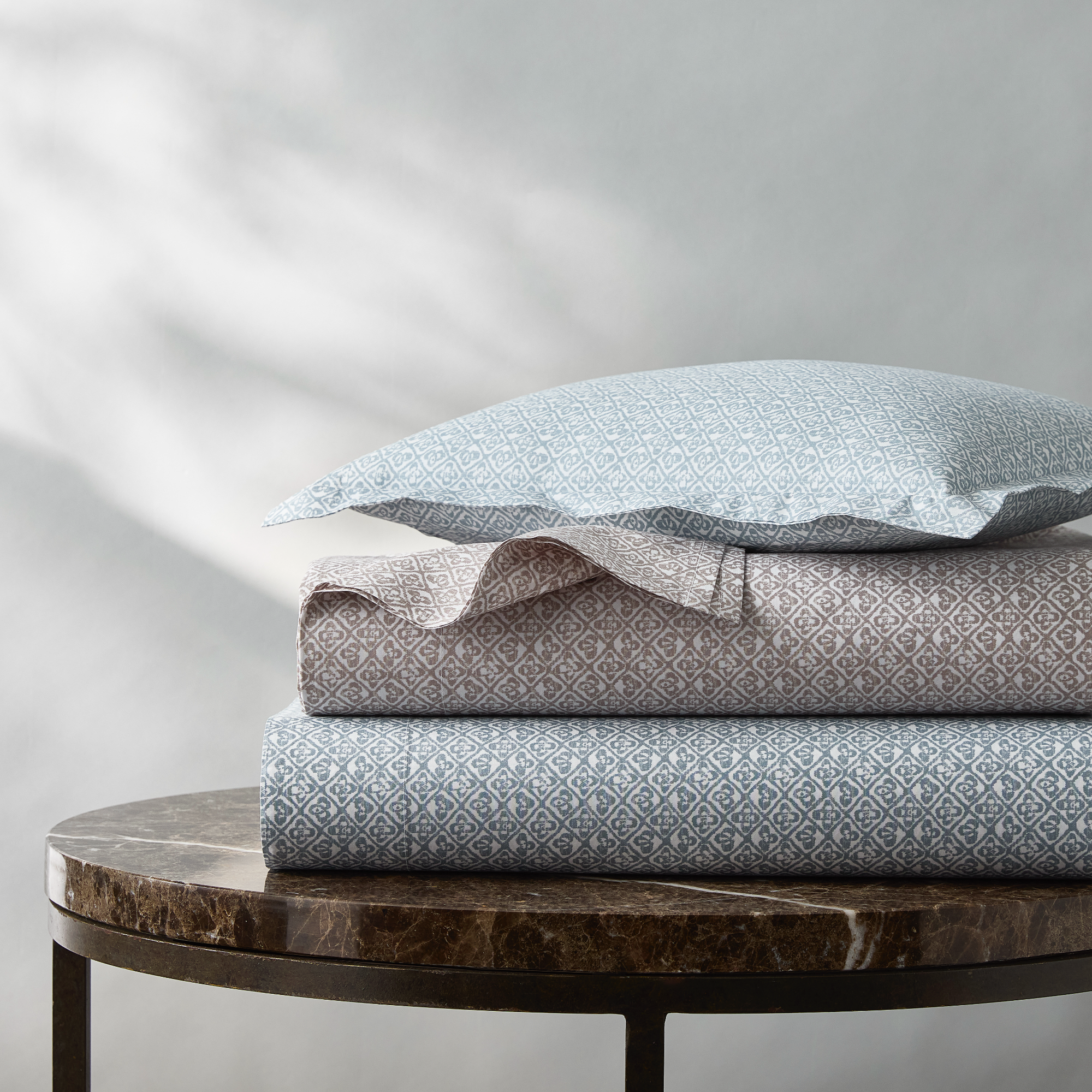 Stack of Matouk Schumacher Catarina Bedding in Both Colors