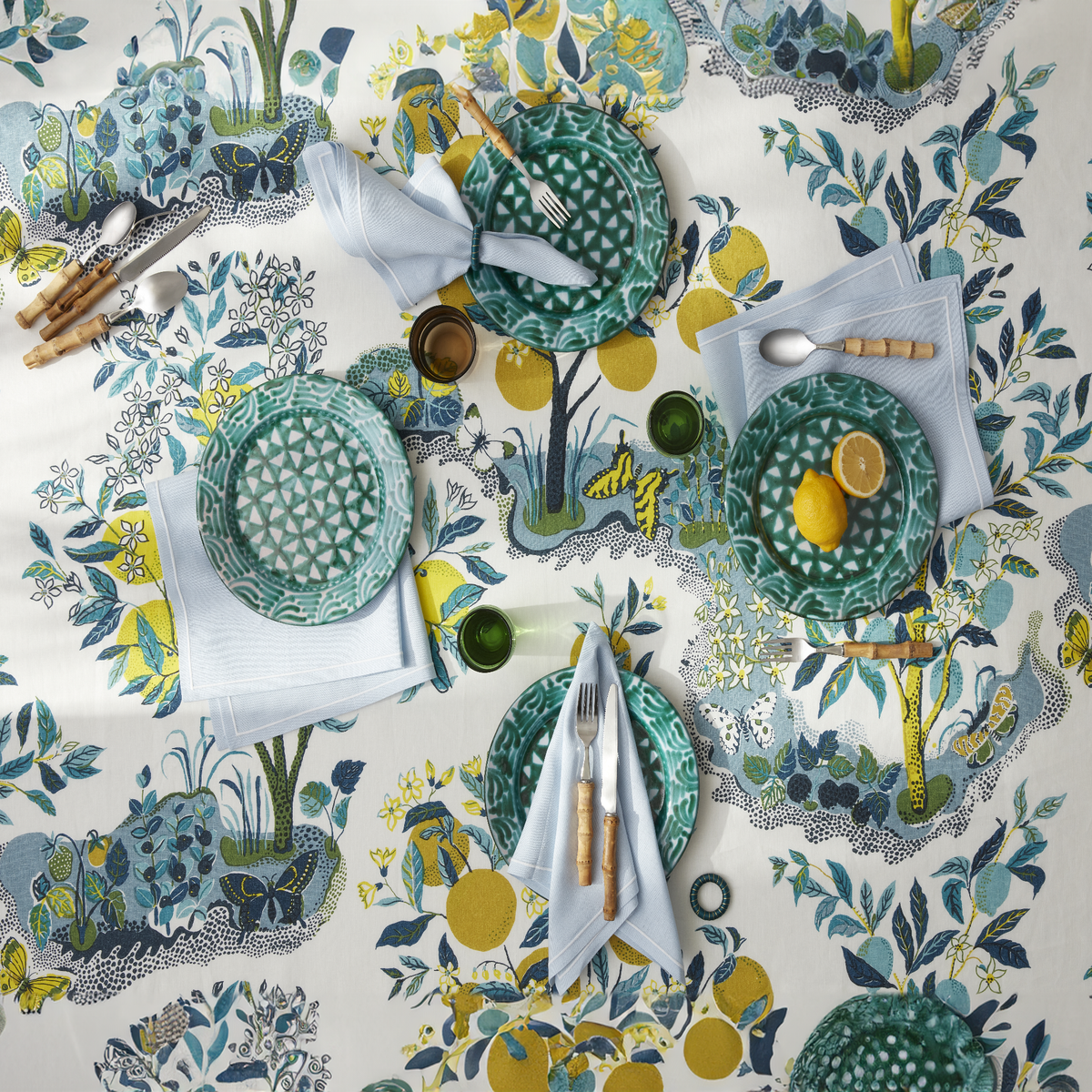 Topview of Matouk Schumacher Citrus Garden Table Linens in Pool Color