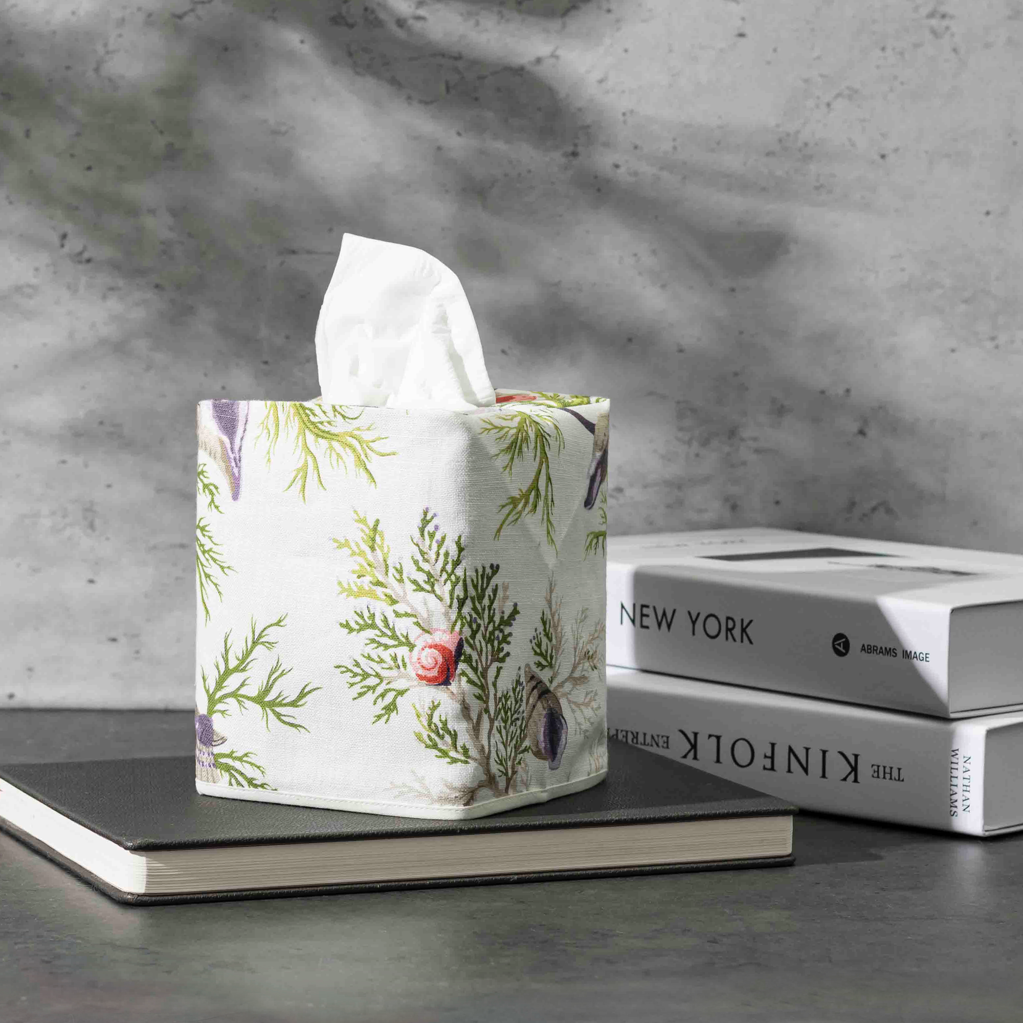 Matouk Schumacher Del Tesoro Linen Tissue Box Cover in Sea Orchid on a table