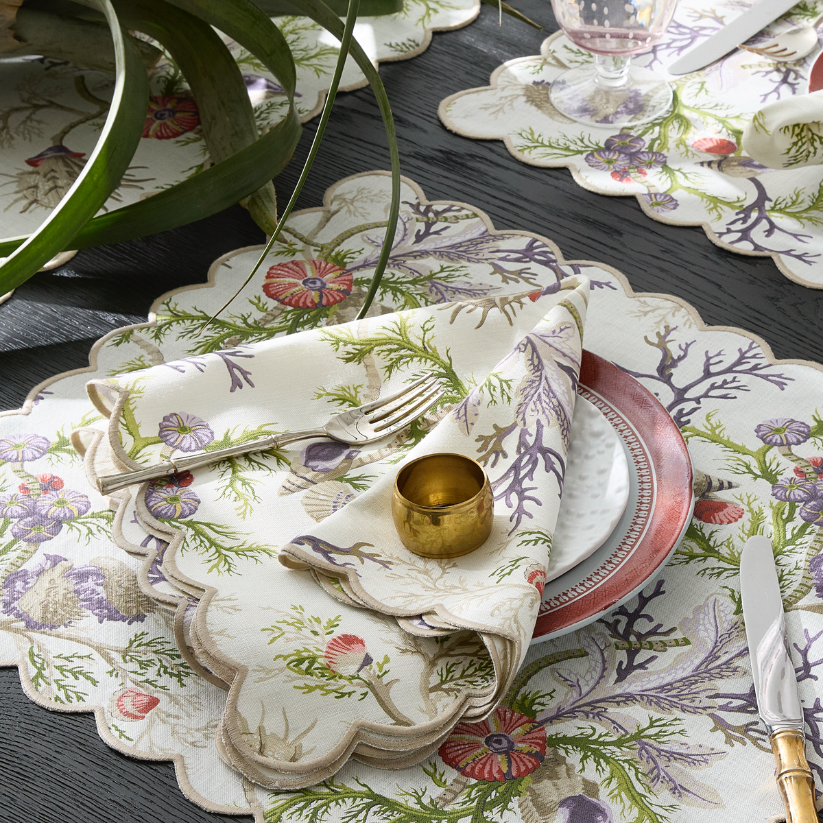 Closeup of Matouk Schumacher Del Tesoro Table Linens in Sea Orchid