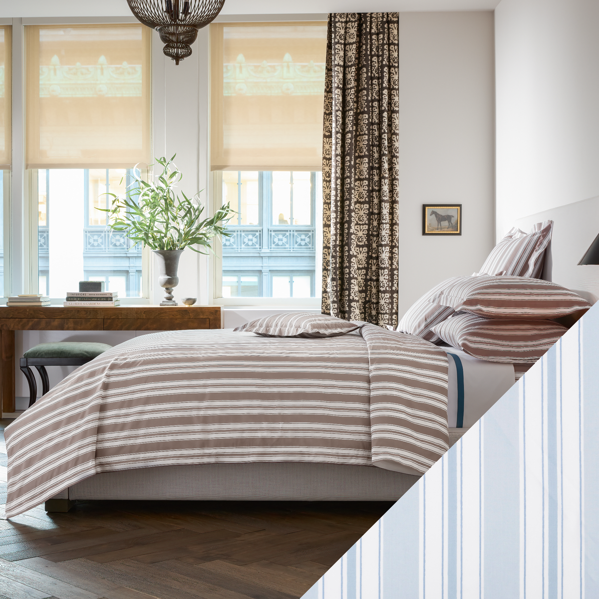 A neatly made bed with Matouk Schumacher Elio Bedding in a sunlit bedroom and Blue Swatch