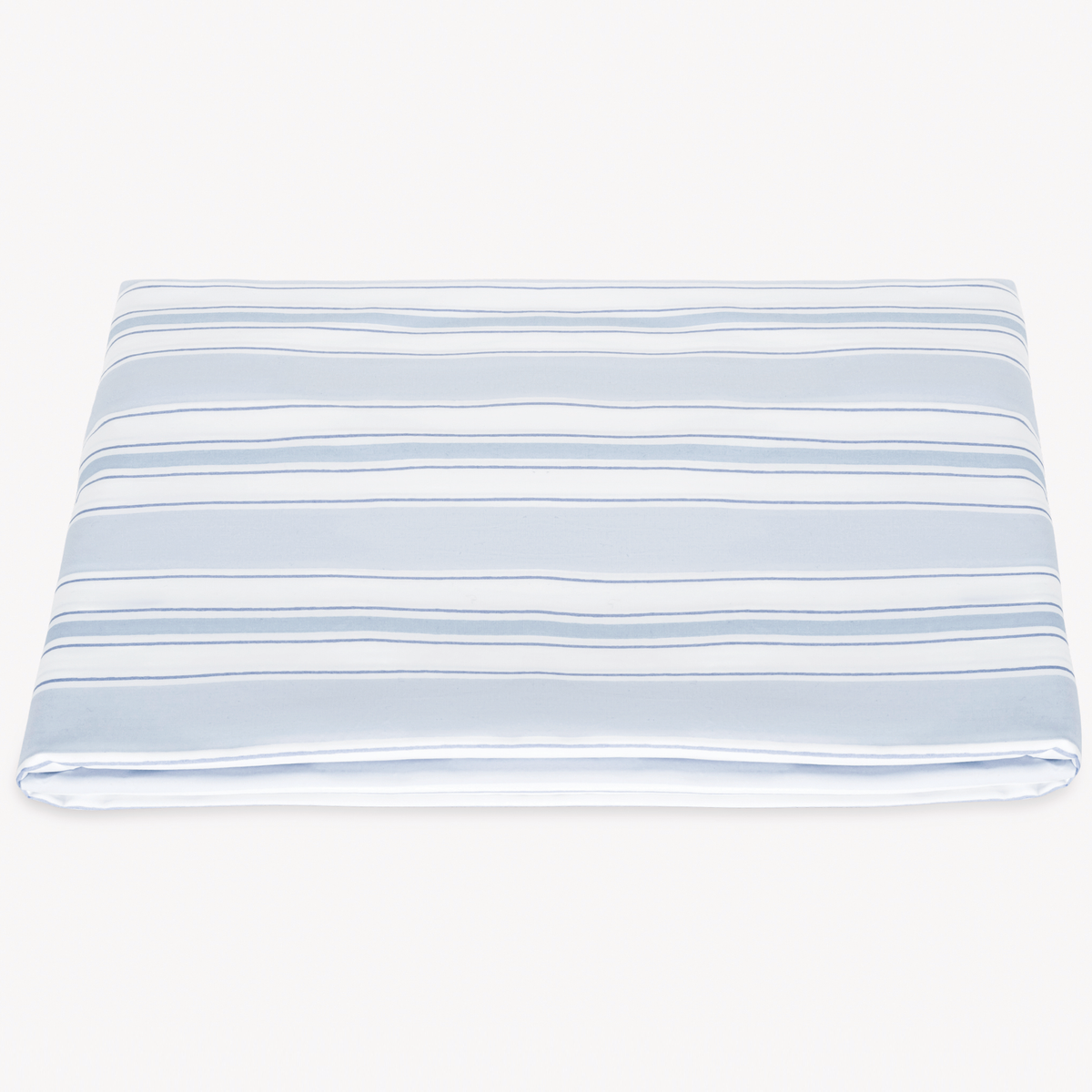 A neatly folded Matouk Schumacher Elio Fitted Sheet in Blue color