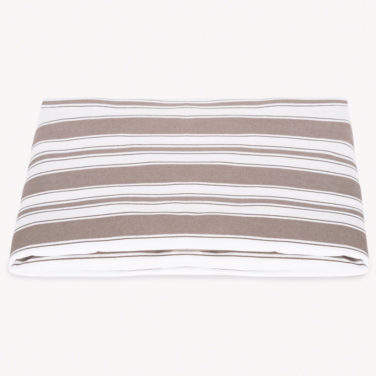 A neatly folded Matouk Schumacher Elio Fitted Sheet in Mocha color