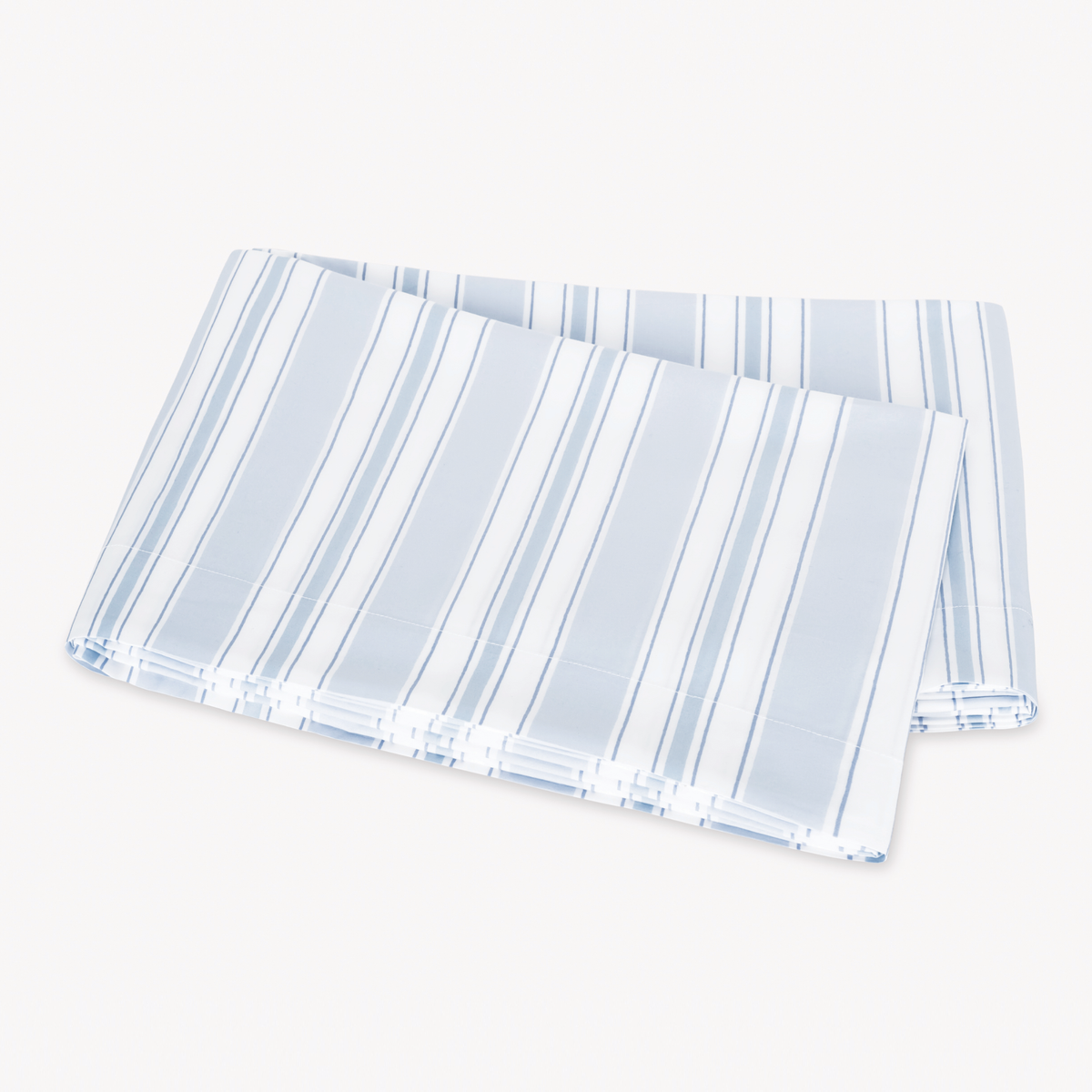 Folded Blue Matouk Schumacher Elio Bedding on a white background