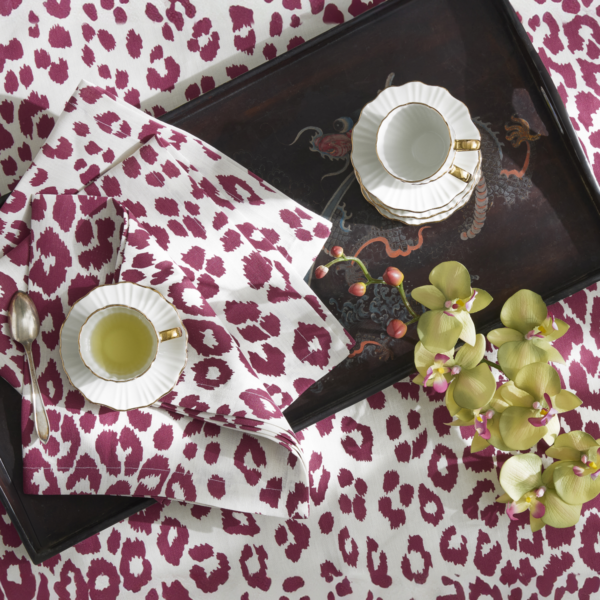 Lifestyle Image of Matouk Schumacher Iconic Leopard Table Linens in Crimson