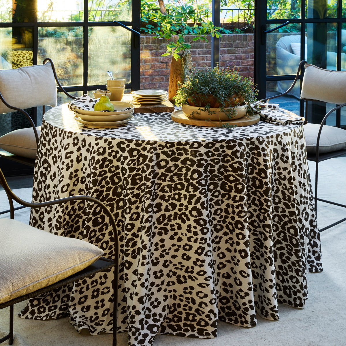 Table Dressed in Matouk Schumacher Iconic Leopard Table Linens in Cinder Color