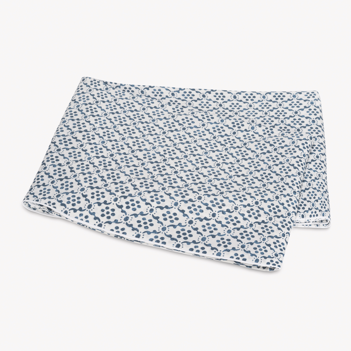Folded Flat Sheet of Matouk Schumacher Laksha Bedding in Indigo color