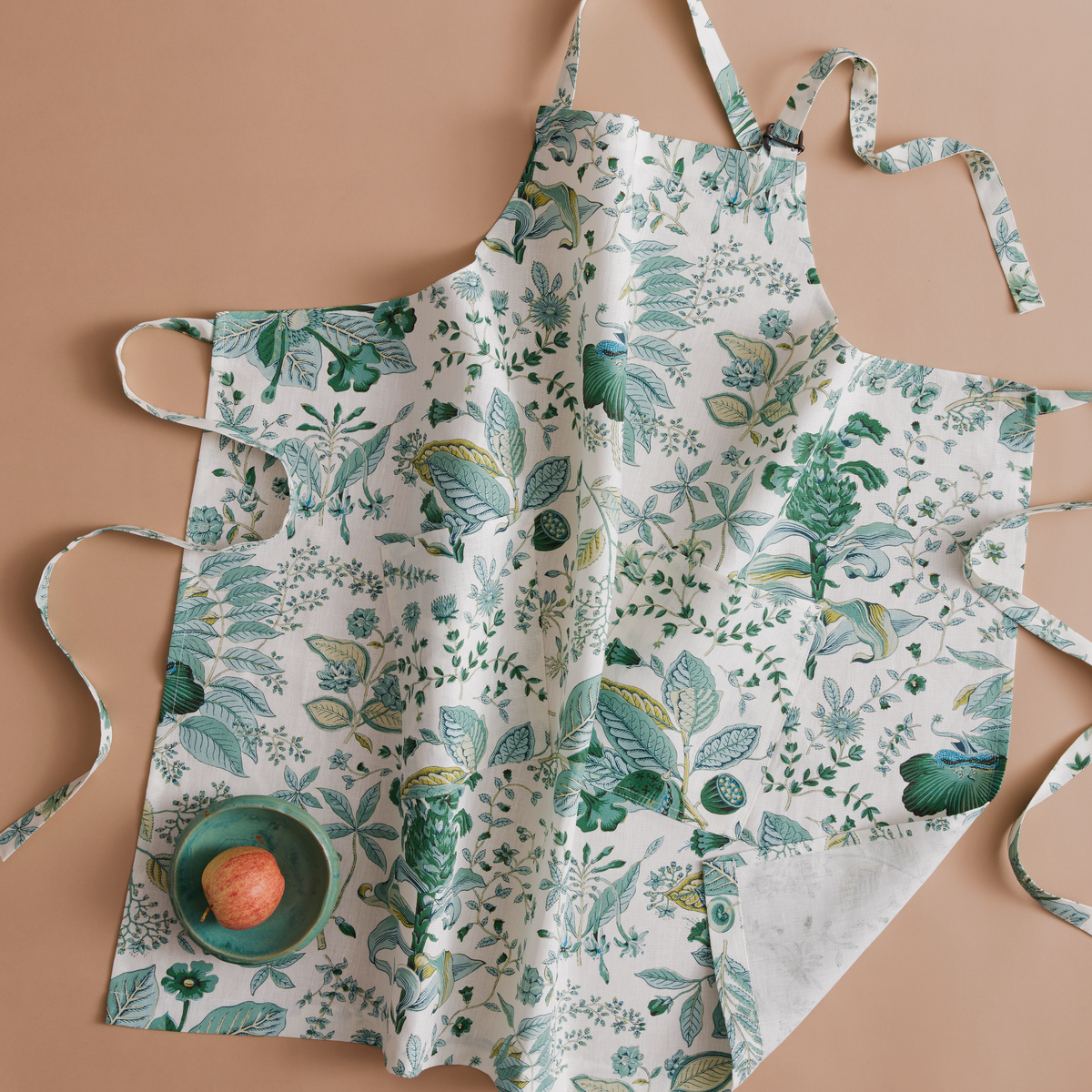 Closeup of Matouk Schumacher Linen Apron in Pomegranate Emerald