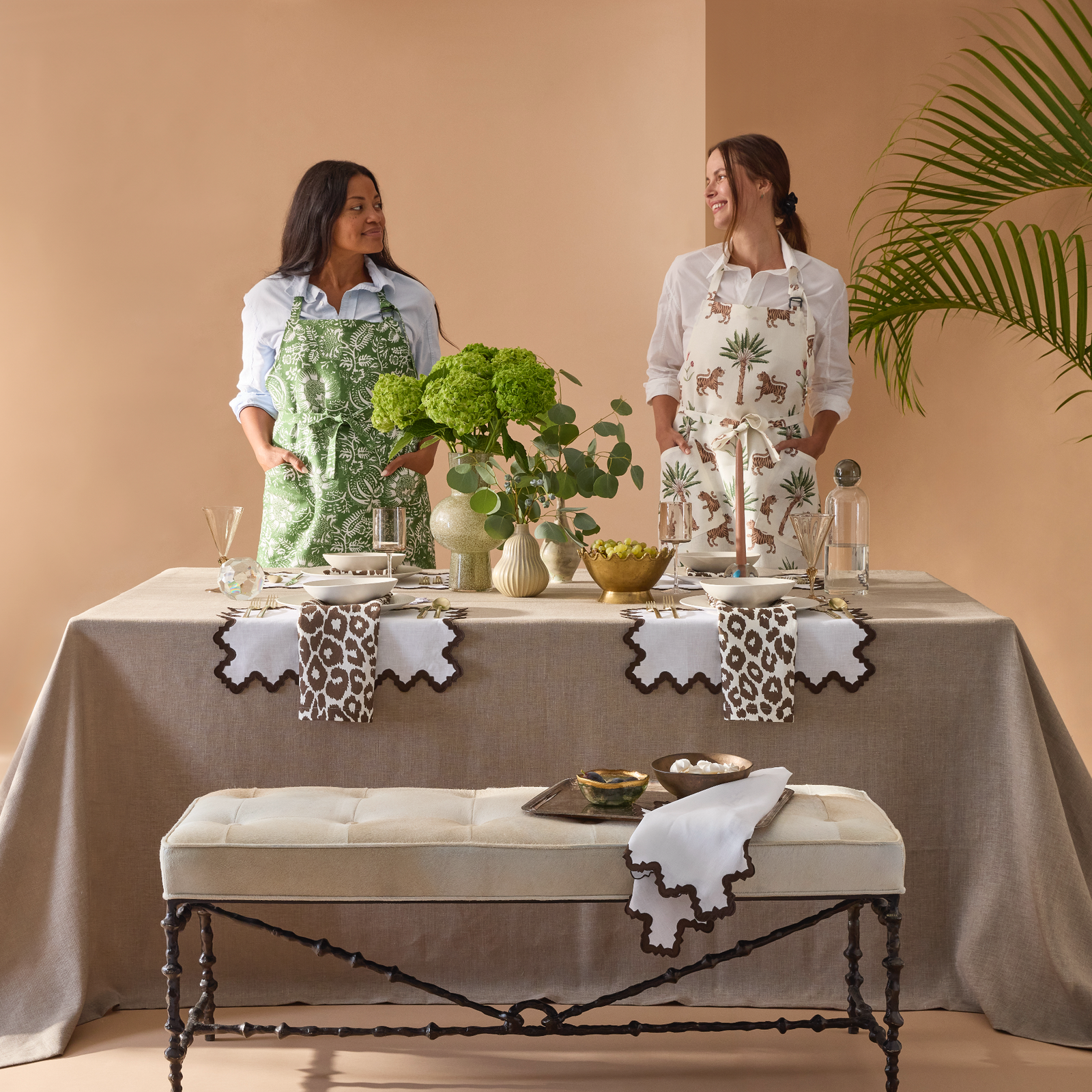 Matouk Schumacher Apron Models Behind Table Linens