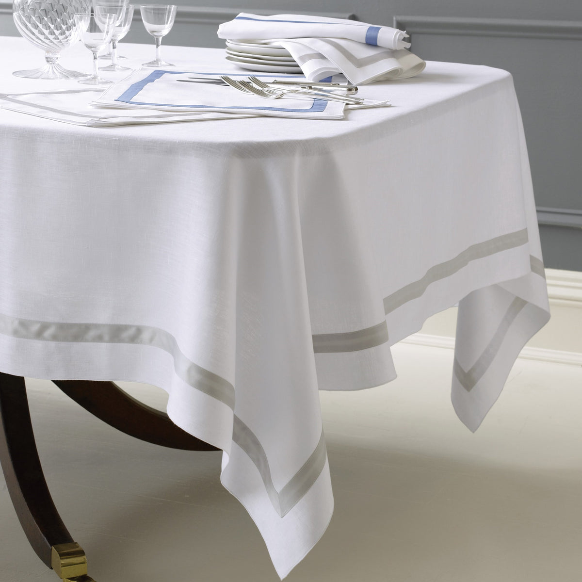 Lifestyle Image of Matouk Schumacher Lowell Table Linens in Color Silver and Azure