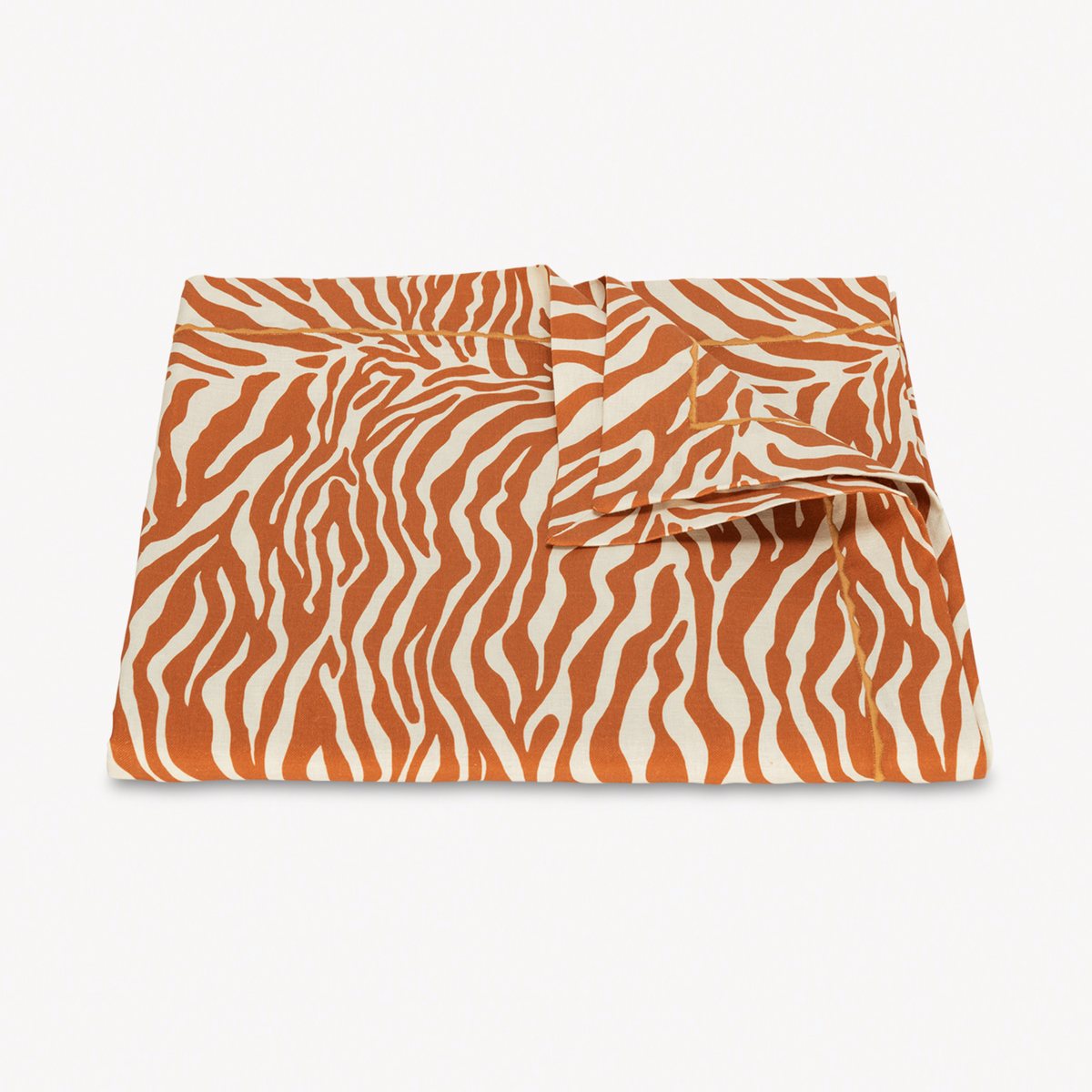 Folded Matouk Schumacher Regine Tablecloth in Persimmon