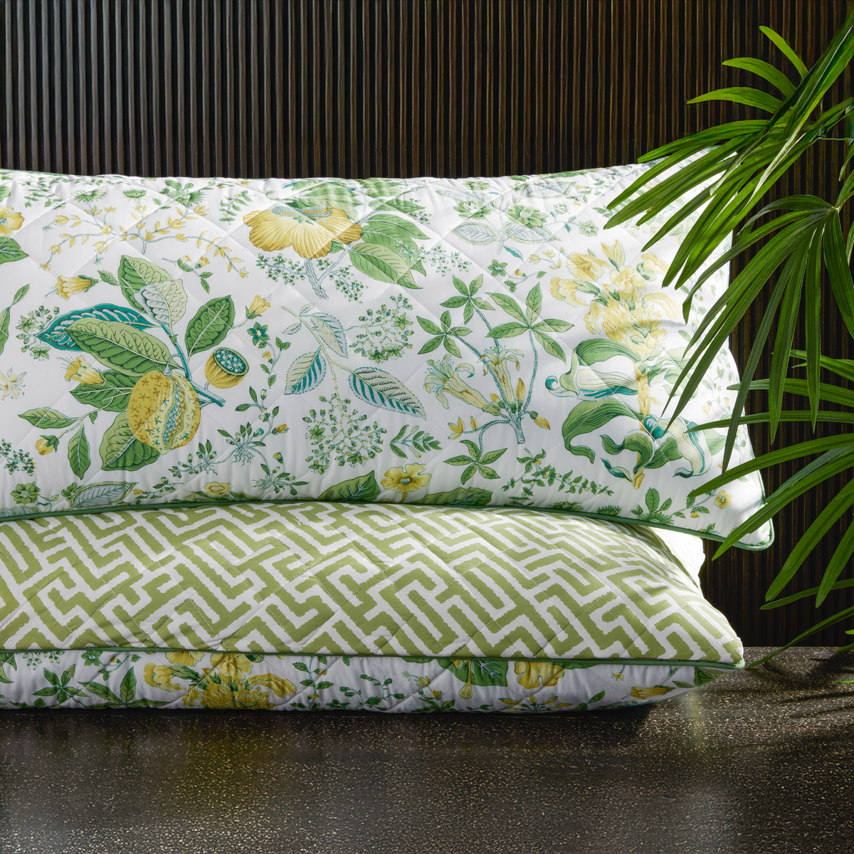 Stack of Matouk Schumacher Reversible Pillow Collection in Pomegranate Citrus/Gabriel Grass