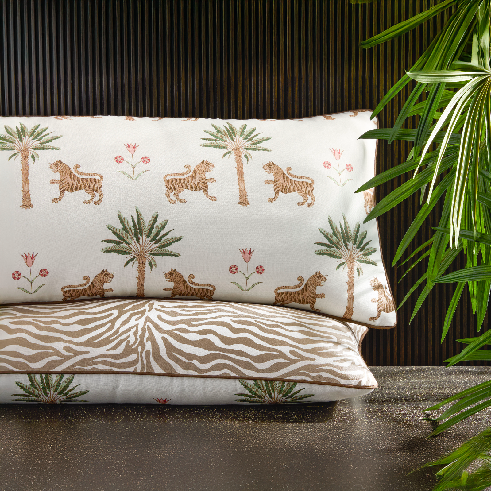 Stack of Matouk Schumacher Reversible Pillow Collection in Tiger Palm/Regine Coconut