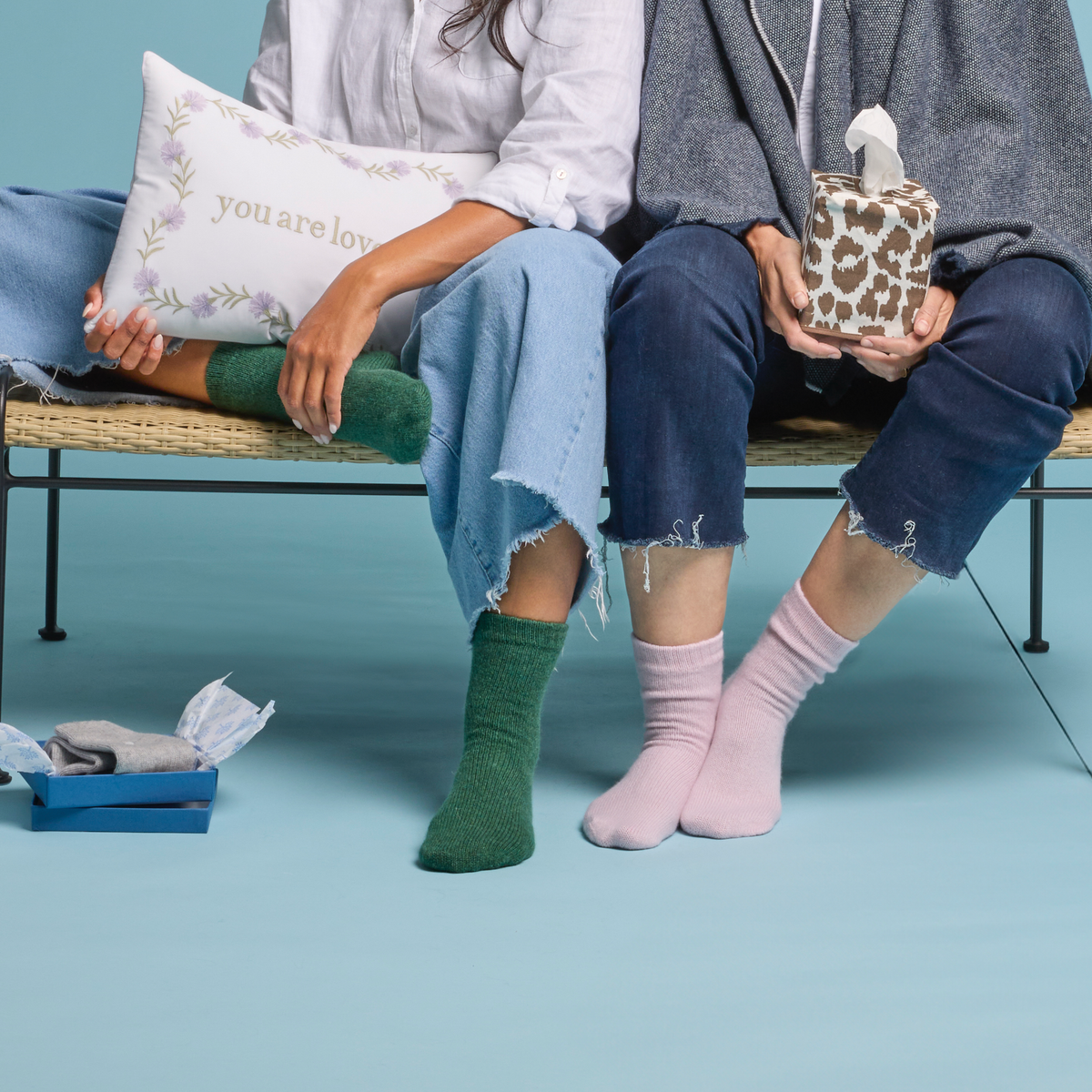 Models Wearing Matouk Sleeping Socks in Emerald and Slipper Colors