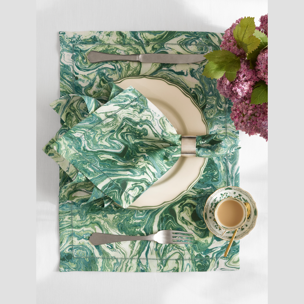 Closeup of Matouk Schumacher Balthazar Table collection in Emerald color