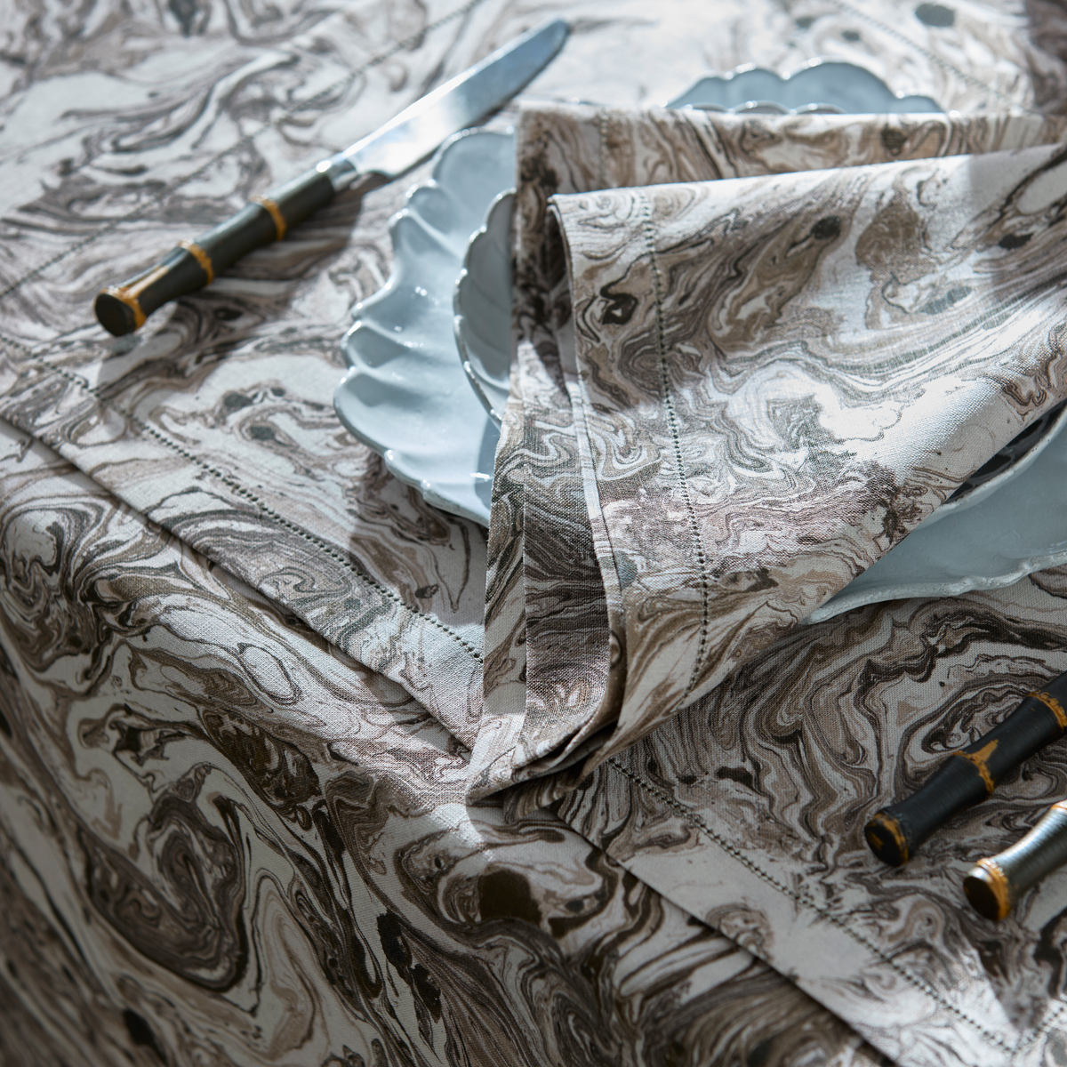 Closeup of Matouk Schumacher Balthazar Table collection in Topaz color