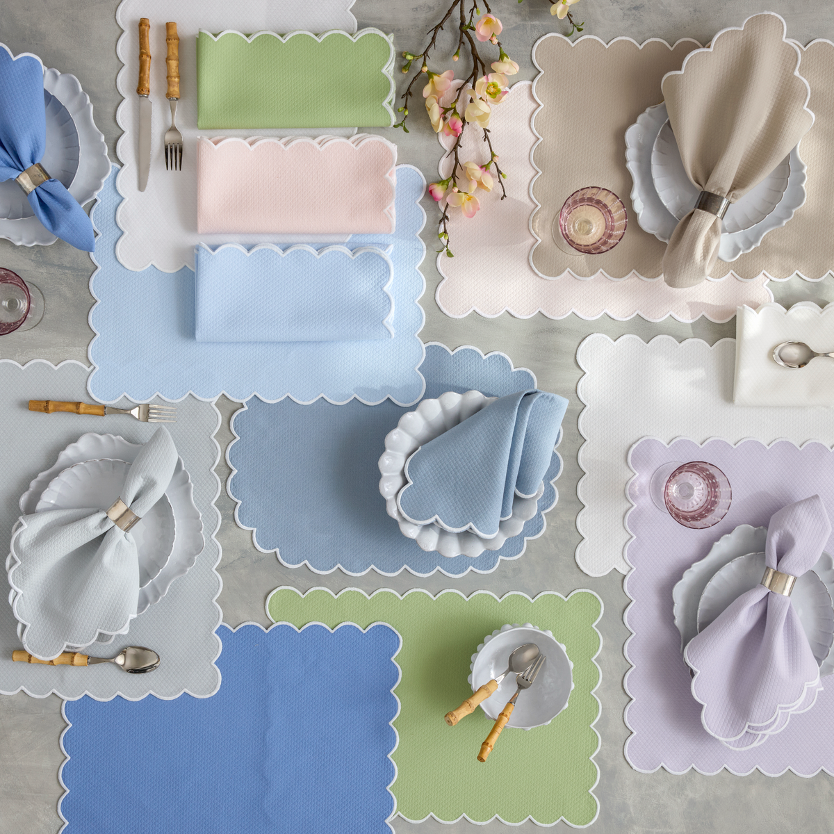 A table set with Matouk Savannah Gardens Table Linens napkins and placemats