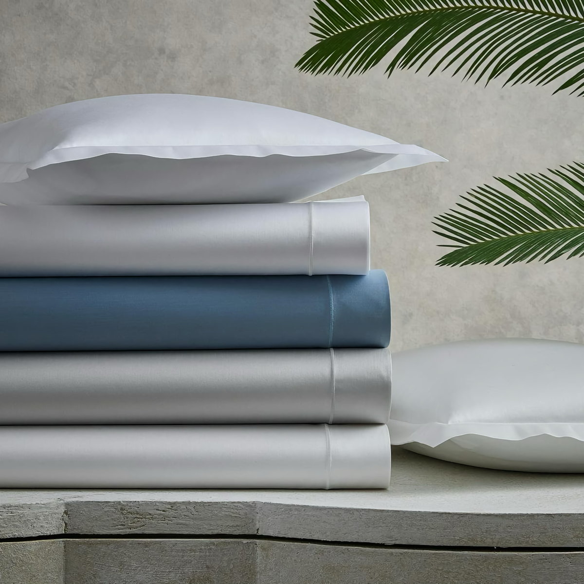 Stack of Matouk Talita Satin Stitch Bedding in all colors
