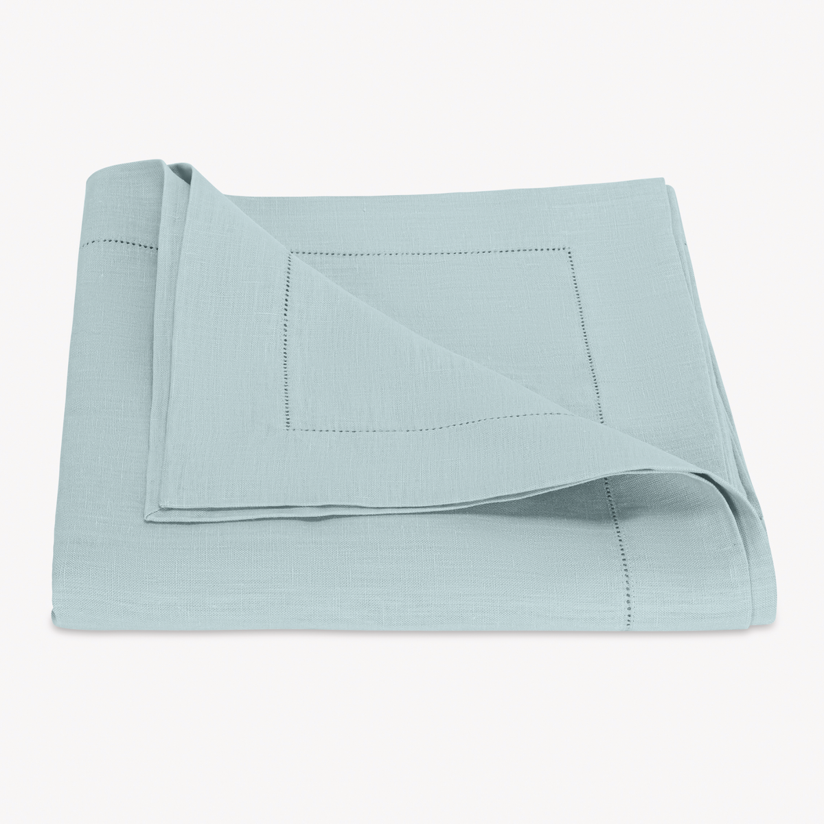 Folded Tablecloth of Matouk Valentina Hemstitch in Sky