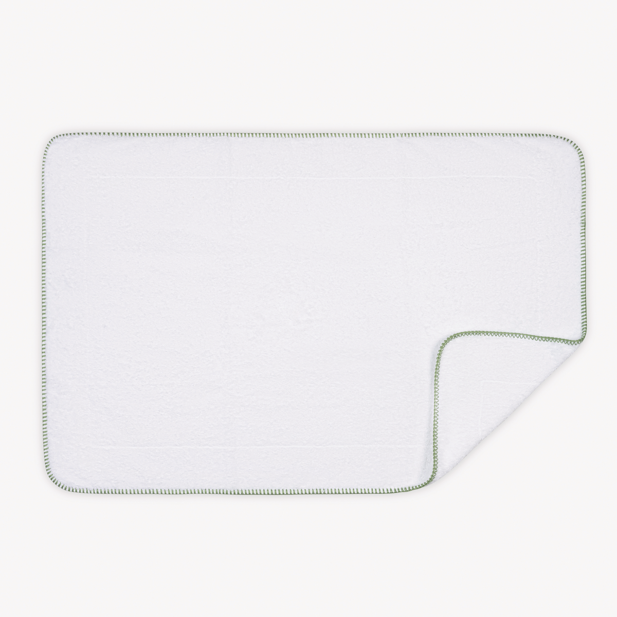 Tubmat of Palm Matouk Whipstitch Bath Collection with folded corner
