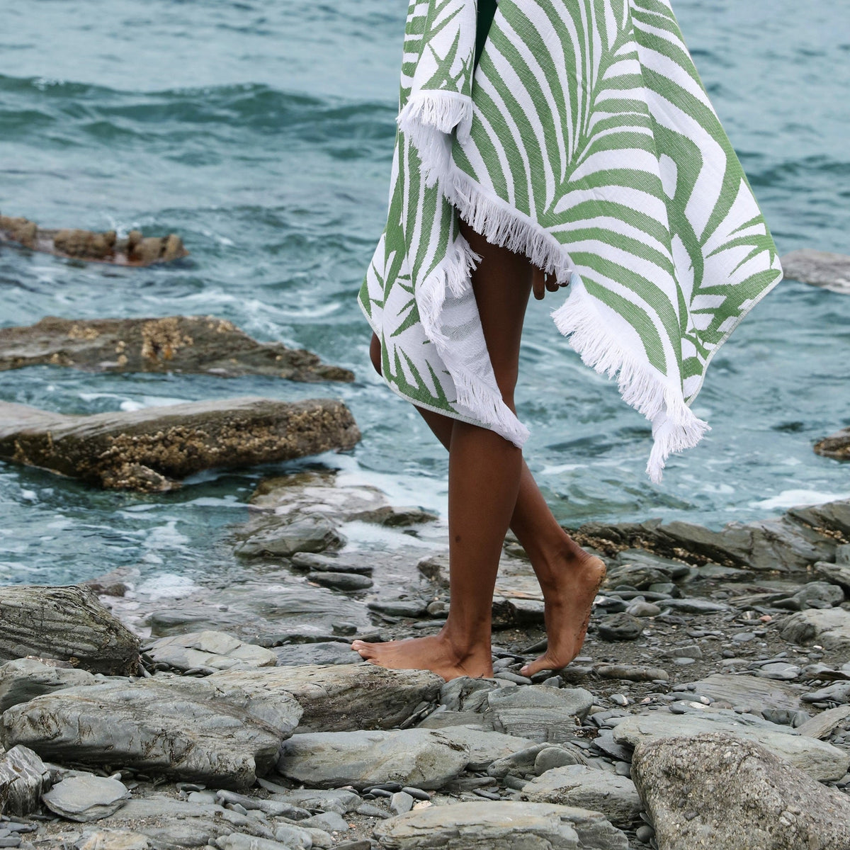 Model with Matouk Zebra Palm Beach Towel in Jungle Color