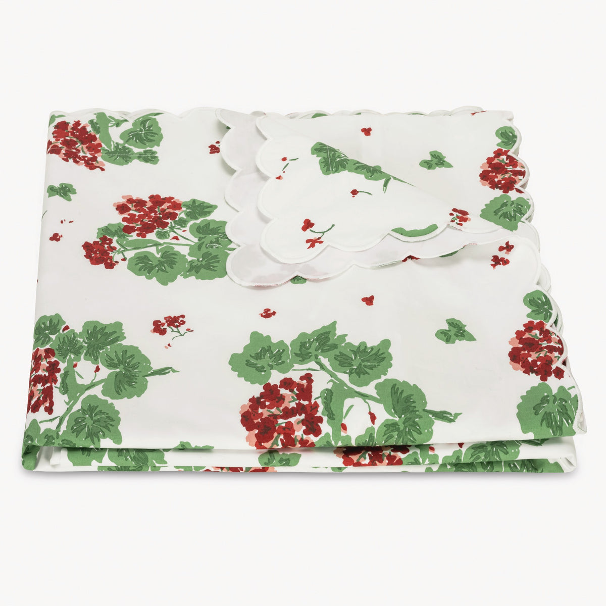 Floral-patterned duvet cover with red and green flowers on a white background