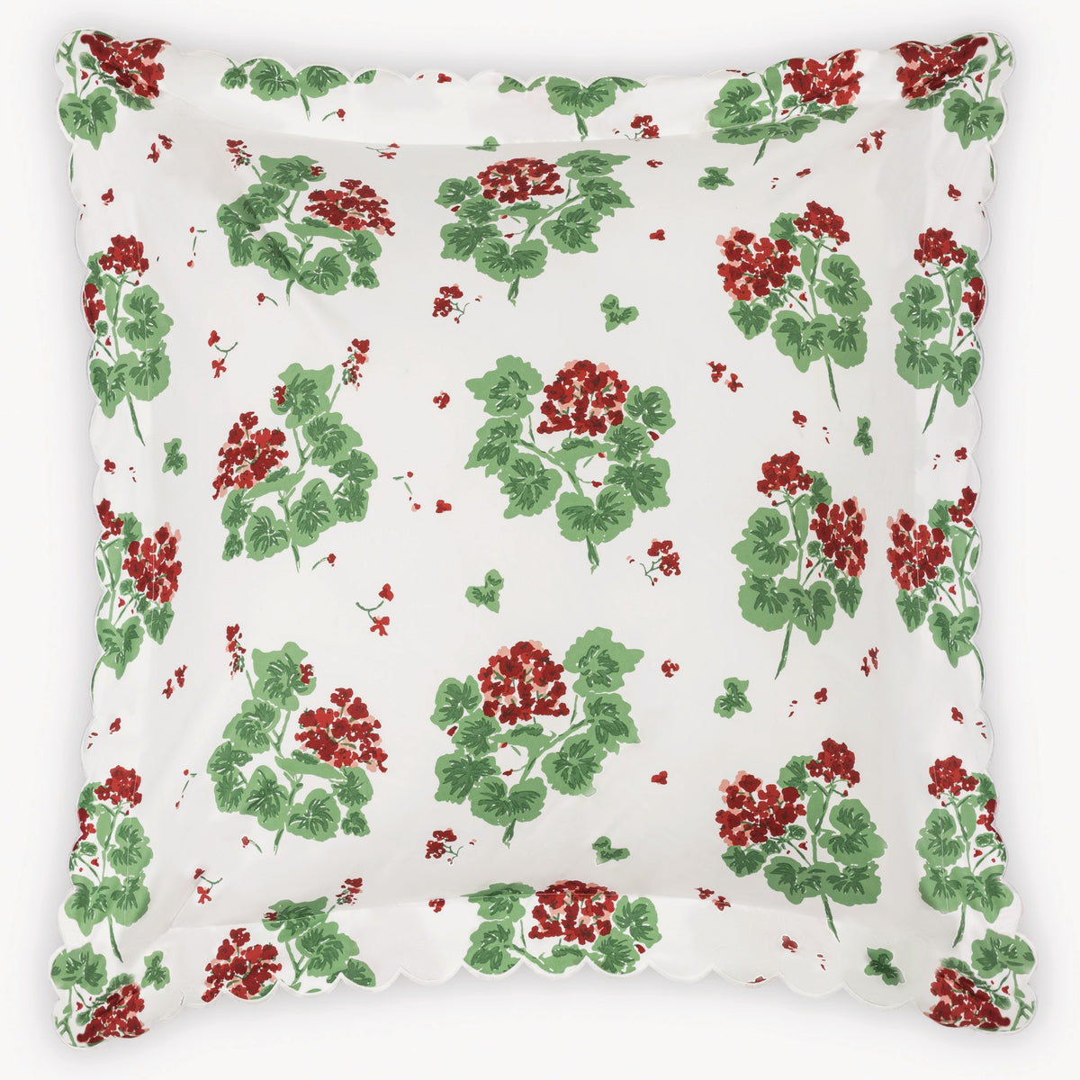 Floral patterned euro sham with red and green flowers on a white background