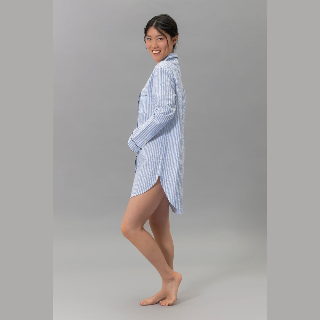 Woman wearing the Matouk Matteo Pajama Shirt in Azure - side view