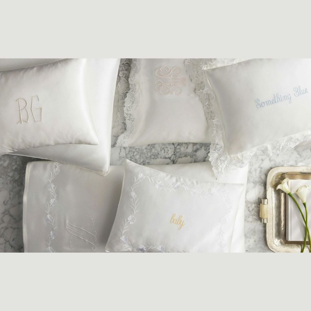 Matouk Silk Collection Pillowcases and Shams lifestyle image on a marble countertop