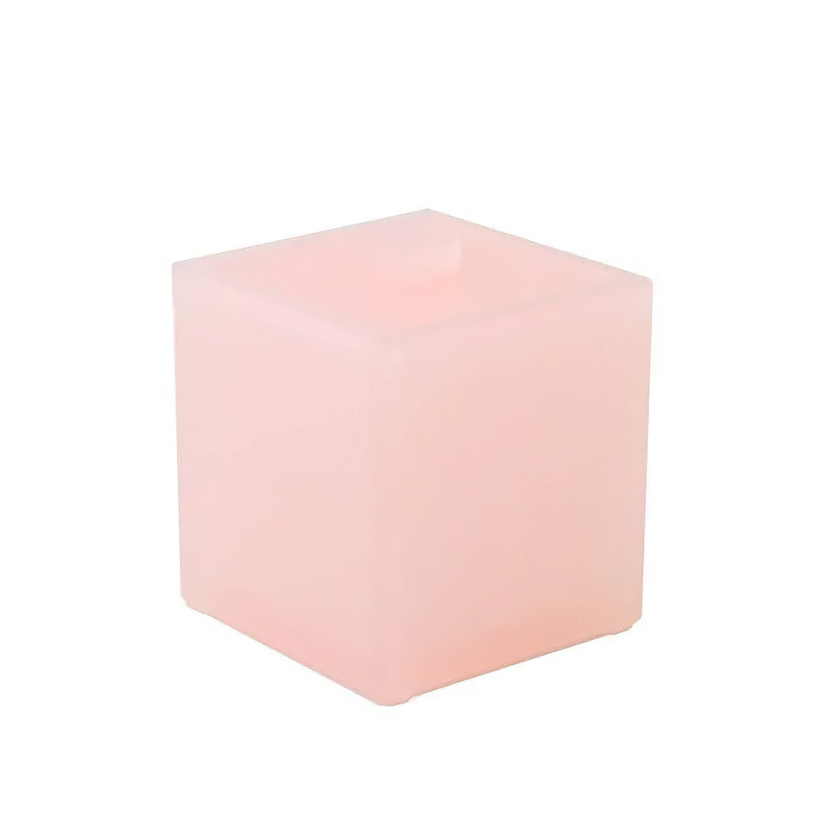 A translucent, light pink cube from the lucite collection is displayed against a white background with smooth, rounded edges.
