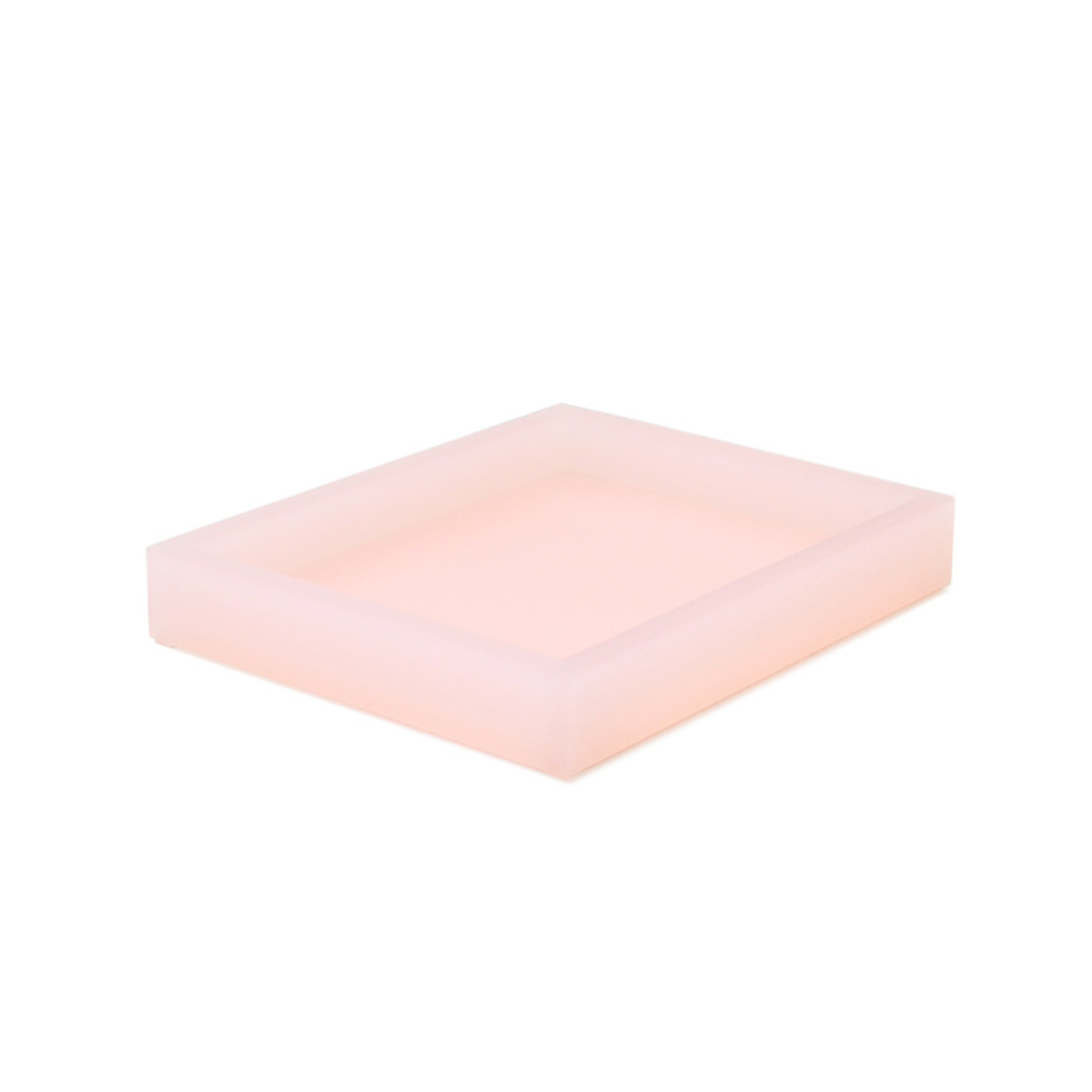 A rectangular, light pink tray from the lucite collection with raised edges, shown on a white background.