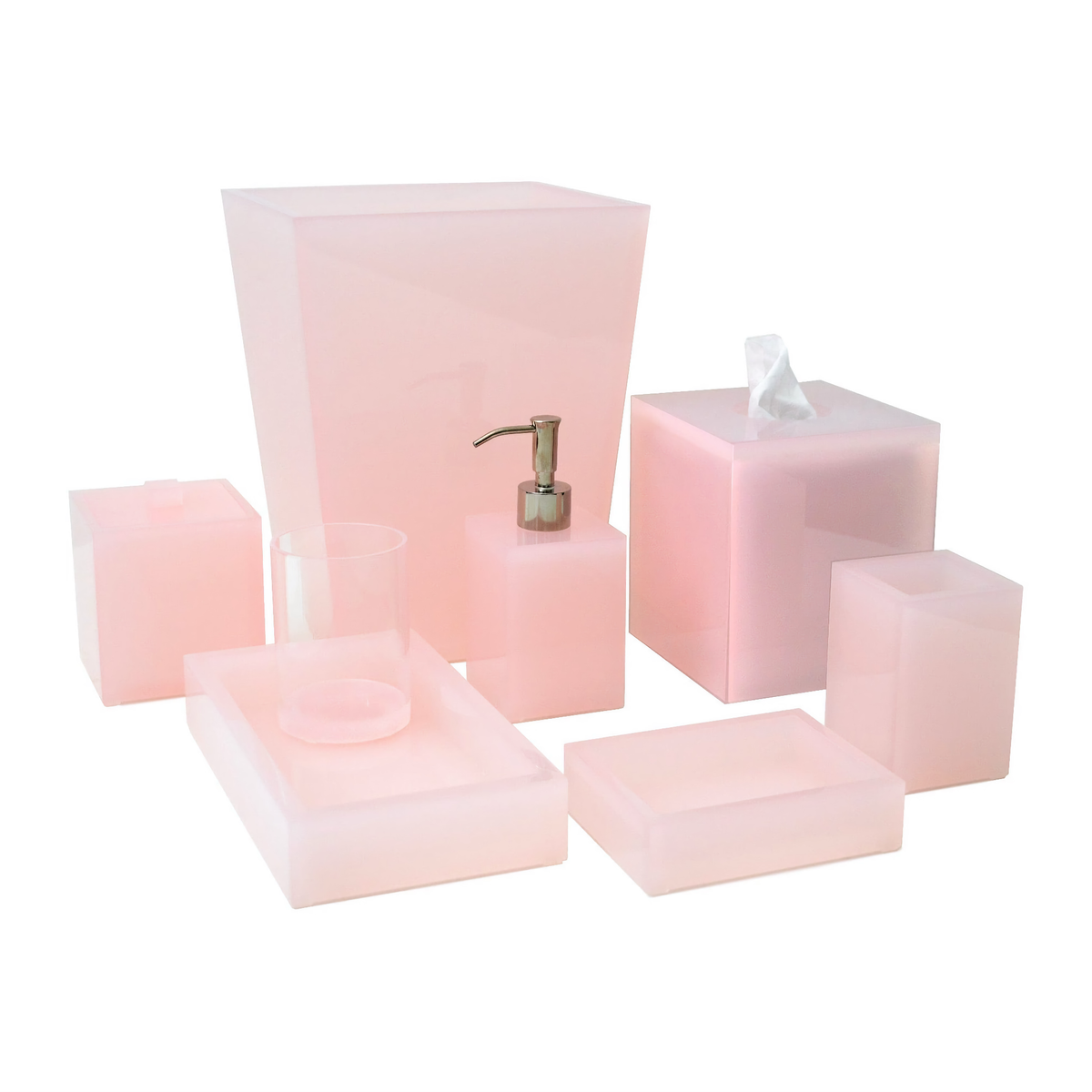 A set of seven translucent pink lucite bath accessories, including containers, trays, a cup, and a soap dispenser.