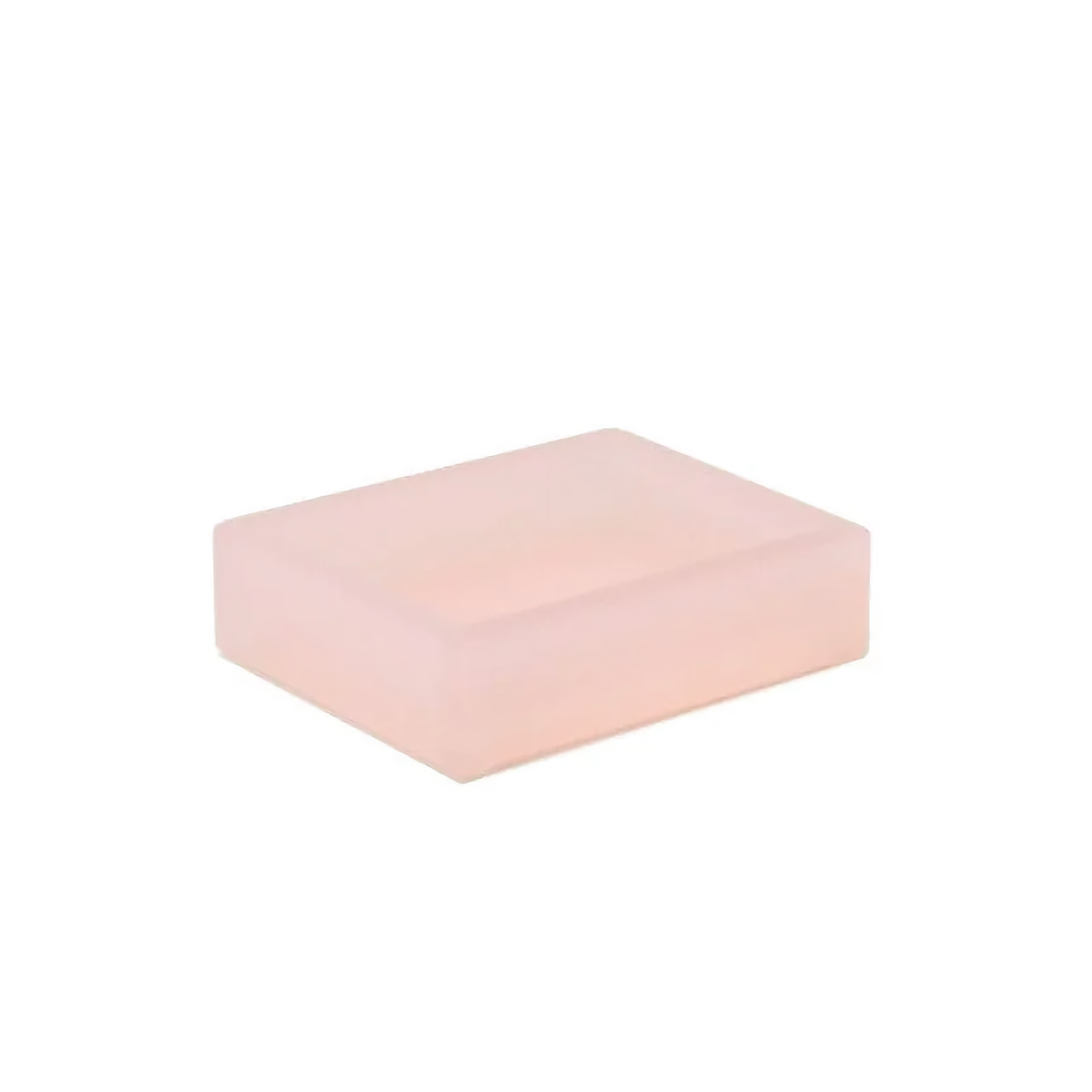 A rectangular, light pink soap bar from the lucite collection against a plain white background.