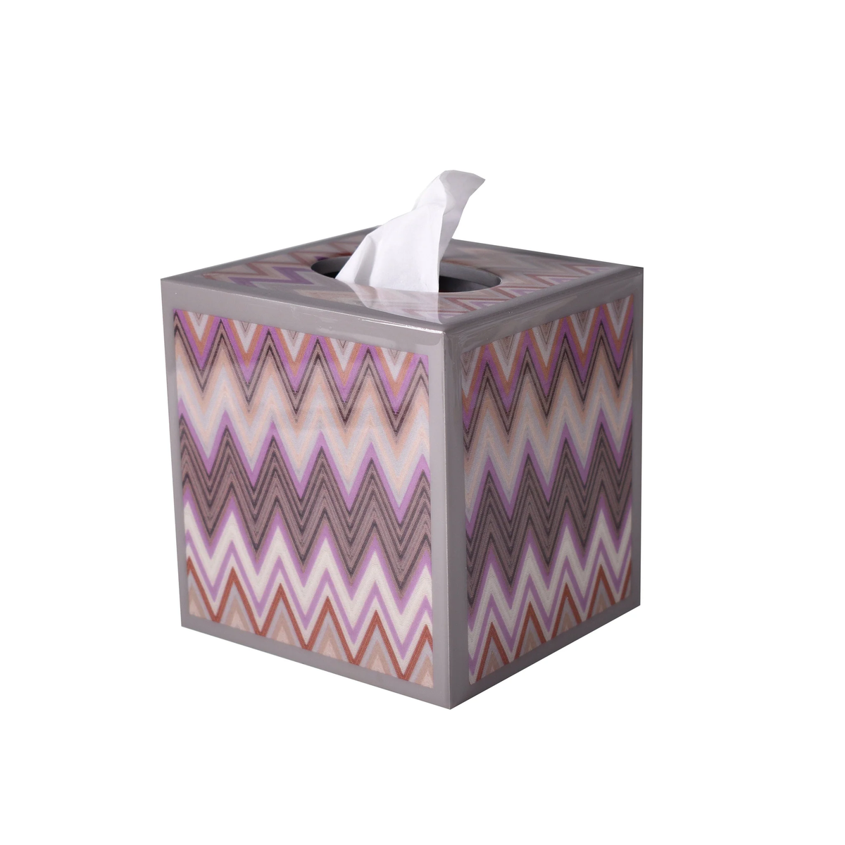 A square tissue box of Mike and Ally Paperwerks Bath Accessories Zigzag Collection with tissue protruding from the top