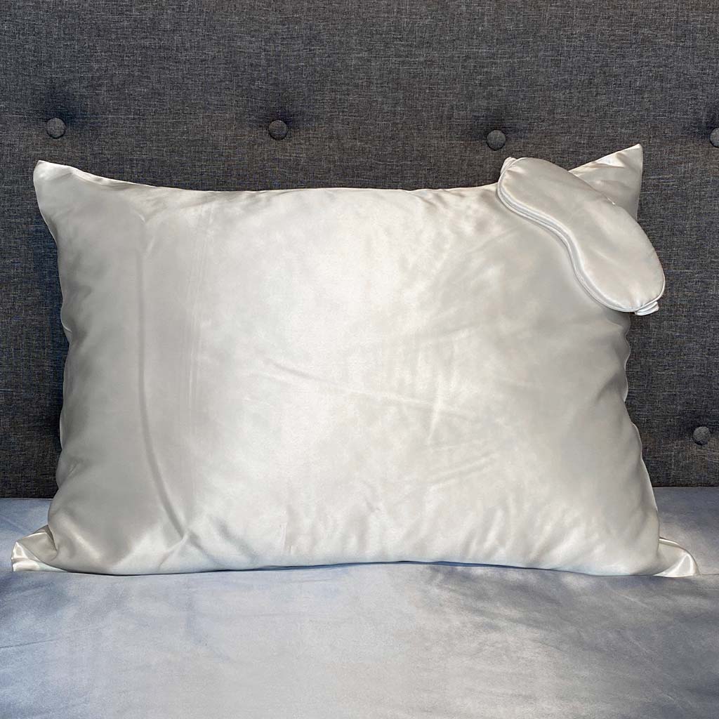 Luxurious white pillowcase with matching sleep mask, smooth and soft for ultimate comfort